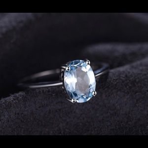 Blue topaz solitaire ring
